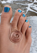 Load image into Gallery viewer, Toe with blue nail polish and a copper spiral ring on a snowy ground