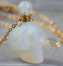 Load image into Gallery viewer, Crystal Skull Necklaces filled with essential oils that bring positive energy.
