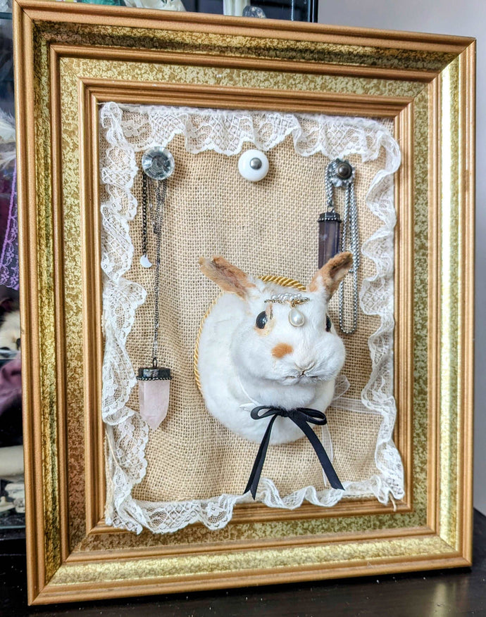 Whimsical White Rabbit jewelry hanger with vintage frame to bring you good fortune.